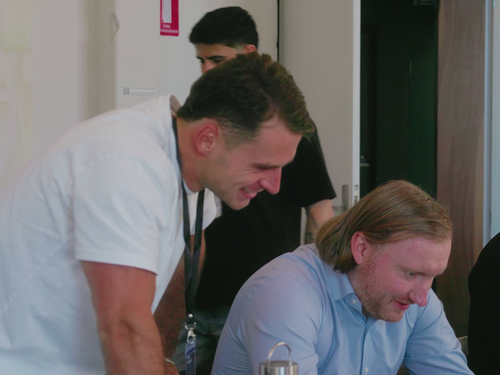 Cooper helping an attendee at their laptop